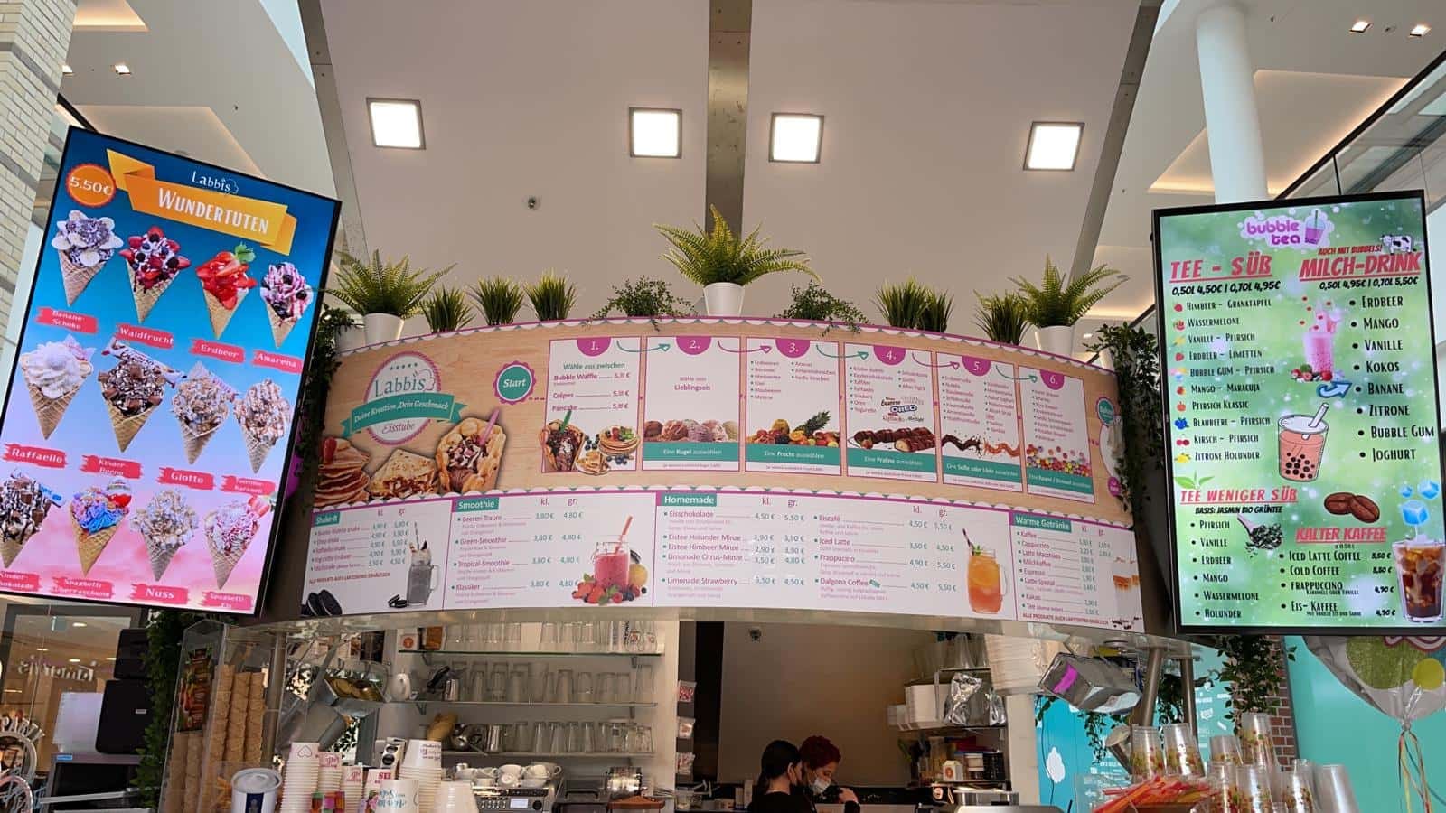 Labbis ice cream parlour, Germany: two portrait menu boards either side of the counter
